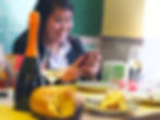 woman taking a picture with her phone of the panettone
